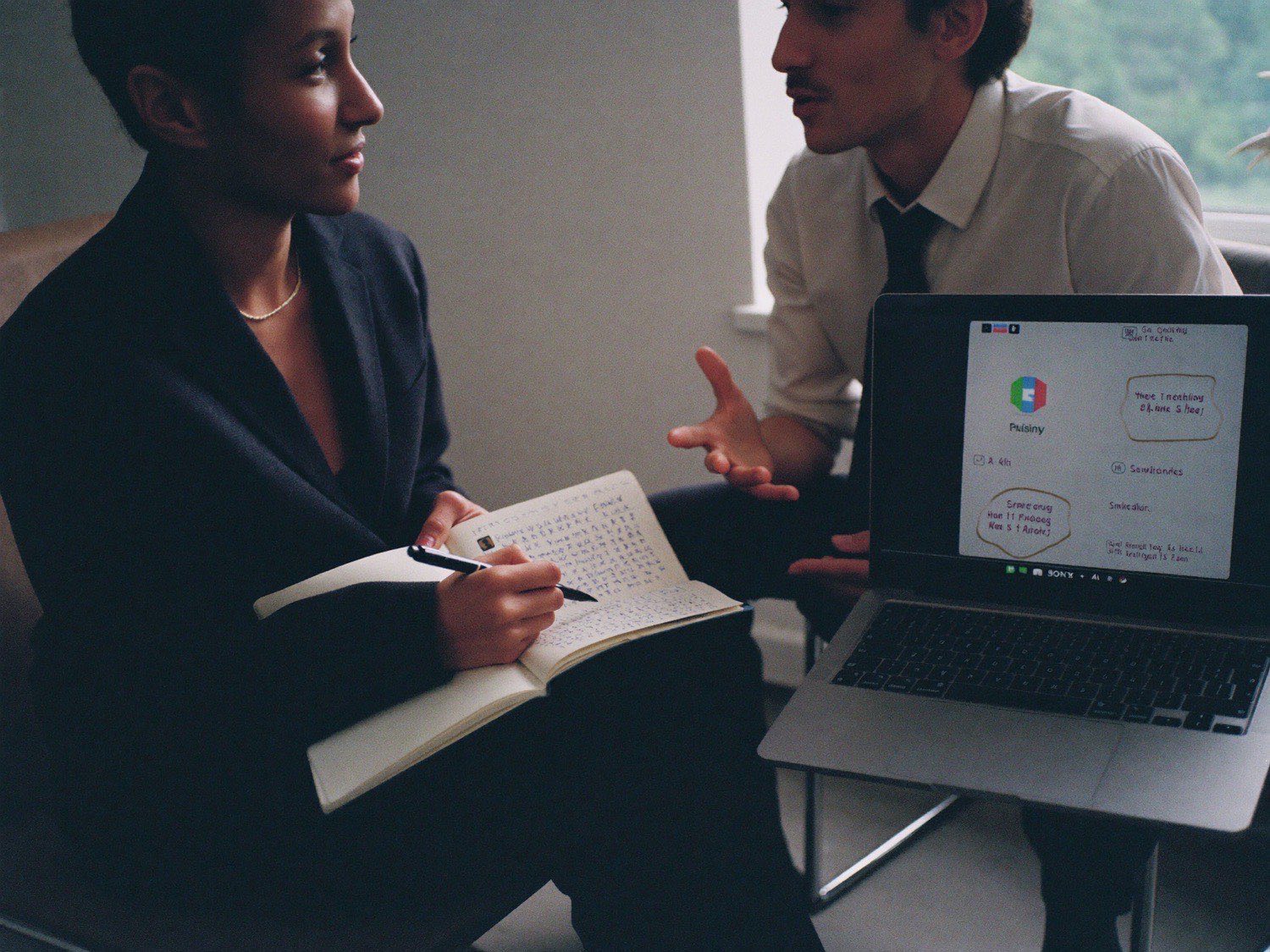 A plain-English chat over a laptop and notes
