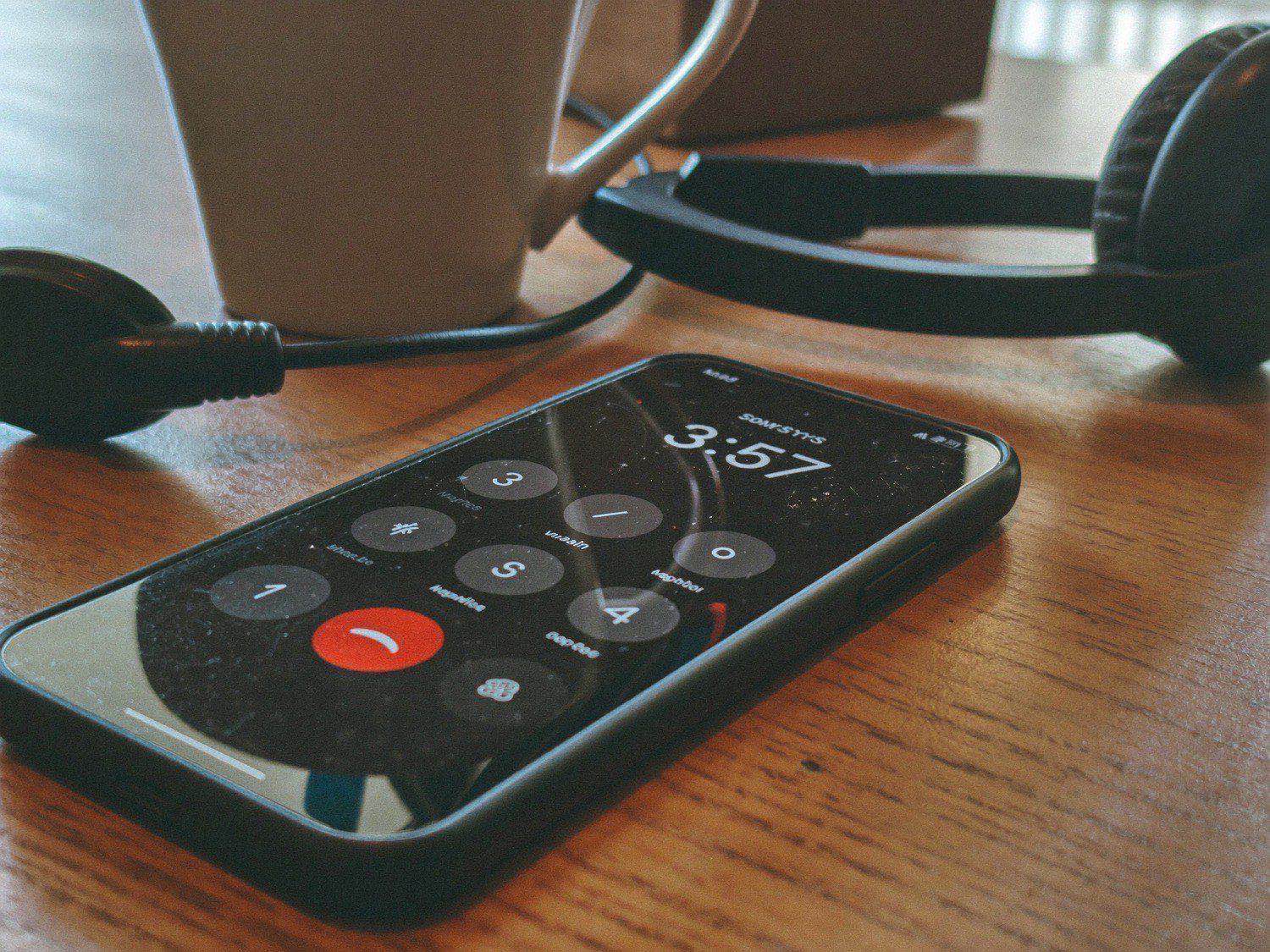 A phone ringing on a quiet workbench, answered automatically